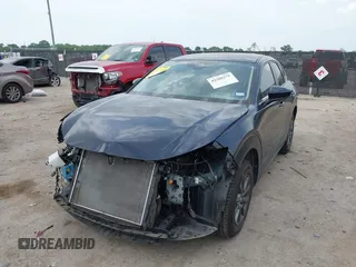 2021 Mazda CX-30 S with VIN 3MVDMAAL4MM302042, listed as a IAAI auction lot 42288275 with 39,821 mi miles and . Bid and sale history available at DreamBid. Image 2.
