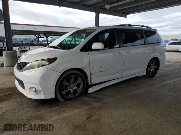 2012 Toyota Sienna SE with VIN 5TDXK3DC9CS215991, listed as a Copart auction lot 51868005 with 215,075 mi miles and Salvage title. Bid and sale history available at DreamBid. Image 1.