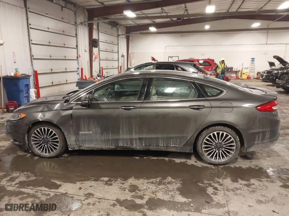 2018 Ford Fusion Hybrid Titanium with VIN 3FA6P0RU4JR147831, listed as a IAAI auction lot 41586033 with 101,088 mi miles. Bid and sale history available at carsss.com. Image 14.