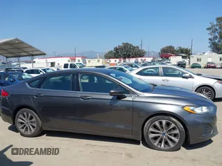 2020 Ford Fusion SE with VIN 3FA6P0T99LR173347, listed as a IAAI auction lot 42090457 with 118,359 mi miles and . Bid and sale history available at DreamBid. Image 13.