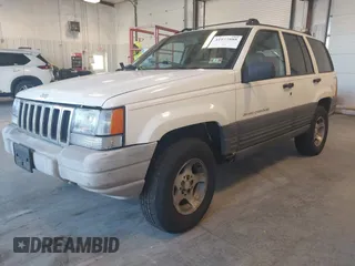1997 Jeep Grand Cherokee Laredo with VIN 1J4GZ58SXVC552435, listed as a IAAI auction lot 41977888 with 143,832 mi miles. Bid and sale history available at carsss.com. Image 2.