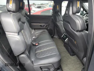 2023 Rivian R1S Adventure with VIN 7PDSGBBA5PN021048, listed as a Copart auction lot 44407815 with 10,642 mi miles and Salvage Title. Bid and sale history available at carsss.com. Image 11.