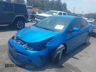 2021 Toyota Prius L Eco with VIN JTDKAMFUXM3134462, listed as a IAAI auction lot 42450931 with 89,239 mi miles and . Bid and sale history available at DreamBid. Image 17.