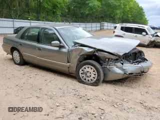 2003 Mercury Grand Marquis GS Convenience z VIN 2MEFM74W03X647685, wystawiony jako Copart lot #54104505 z przebiegiem 67 396 mil mil oraz Szkody całkowita. Historia ofert i sprzedaży dostępna na DreamBid. Obrazek 4.