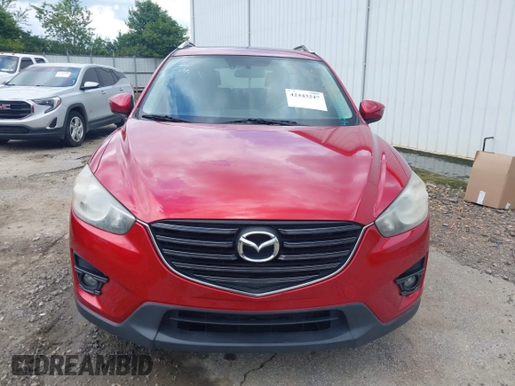 2016 Mazda CX-5 Grand Touring z VIN JM3KE2DY6G0693678, wystawiony jako IAAI lot #42443247 z przebiegiem 127 620 mil mil oraz . Historia ofert i sprzedaży dostępna na DreamBid. Obrazek 12.