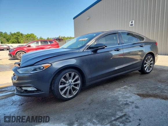 2017 Ford Fusion Titanium z VIN 3FA6P0D96HR251752, wystawiony jako Copart lot #61568705 z przebiegiem 173 479 mil mil oraz Nie do naprawy • Non repairable. Historia ofert i sprzedaży dostępna na DreamBid. Obrazek 1.