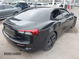 2021 Maserati Ghibli S with VIN ZAM57YSA3M1365483, listed as a IAAI auction lot 42562390 with 51,954 mi miles and . Bid and sale history available at DreamBid. Image 4.
