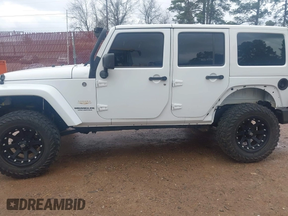 2014 Jeep Wrangler Unlimited Sahara z VIN 1C4BJWEG6EL245986, wystawiony jako IAAI lot #41498492 z przebiegiem 125 882 mil mil oraz . Historia ofert i sprzedaży dostępna na DreamBid. Obrazek 15.