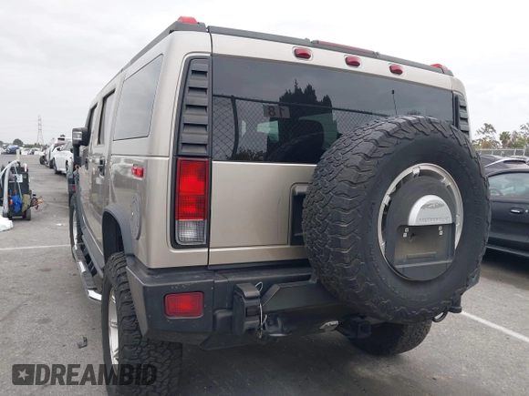 2005 Hummer H2 SUV with VIN 5GRGN23U95H129470, listed as a IAAI auction lot 42046654 with 63,489 mi miles. Bid and sale history available at carsss.com. Image 3.