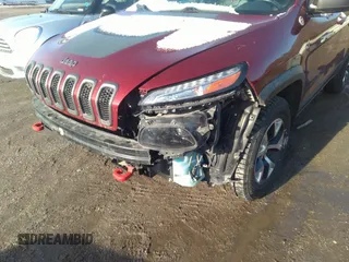 2014 Jeep Cherokee Trailhawk with VIN 1C4PJMBS9EW161047, listed as a IAAI auction lot 41841038 with Not Provided miles. Bid and sale history available at carsss.com. Image 6.