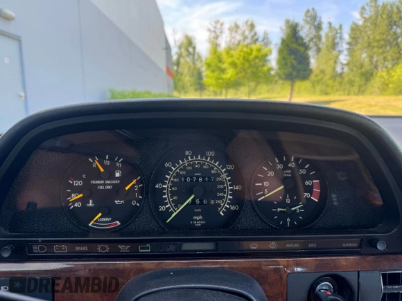 1986 Mercedes-Benz 560 with VIN WDBCA39D0GA203068, listed as a Copart auction lot 56704555 with 107,817 mi miles and Clean Title. Bid and sale history available at DreamBid. Image 8.