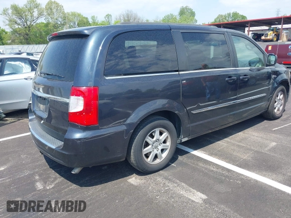 2013 Chrysler Town & Country Touring with VIN 2C4RC1BG8DR594671, listed as a IAAI auction lot 42039026 with 208,909 mi miles. Bid and sale history available at carsss.com. Image 4.