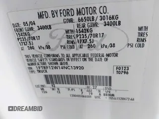 2004 Ford F-150 XL with VIN 1FTRF12W14NC13920, listed as a IAAI auction lot 41702497 with 196,718 mi miles. Bid and sale history available at carsss.com. Image 9.