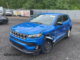 2025 Jeep Compass Sport with VIN 3C4NJDAN5ST528384, listed as a Copart auction lot 56180685 with 4,982 mi miles and Salvage title. Bid and sale history available at DreamBid. Image 2.