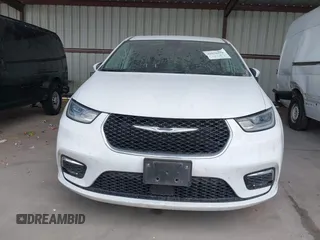 2023 Chrysler Pacifica Touring L with VIN 2C4RC1BG6PR550575, listed as a IAAI auction lot 42576498 with 54,373 mi miles and . Bid and sale history available at DreamBid. Image 6.