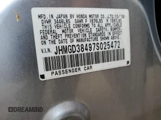 2007 Honda Fit z VIN JHMGD38497S025472, wystawiony jako Copart lot #55901095 z przebiegiem 120 216 mil mil oraz Szkoda całkowita • Salvage title. Historia ofert i sprzedaży dostępna na DreamBid. Obrazek 13.