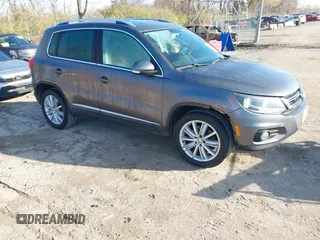 2012 Volkswagen Tiguan SEL with VIN WVGAV7AX2CW000962, listed as a IAAI auction lot 40815475 with 162,859 mi miles and . Bid and sale history available at DreamBid. Image 1.
