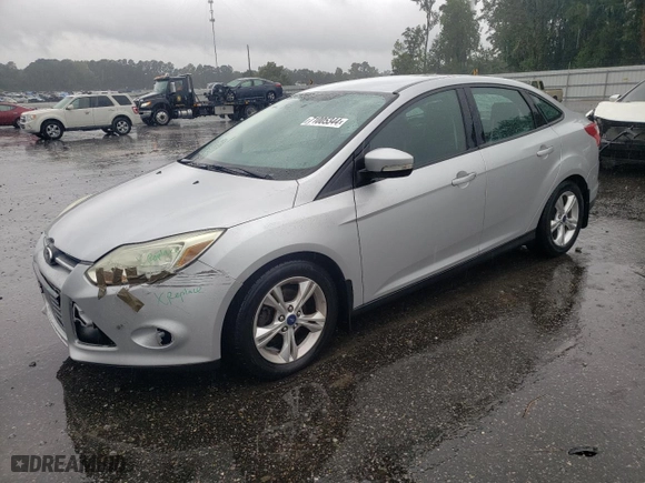 2014 Ford Focus SE with VIN 1FADP3F22EL103956, listed as a Copart auction lot 71005344 with 102,509 mi miles and Salvage Title. Bid and sale history available at carsss.com. Image 1.