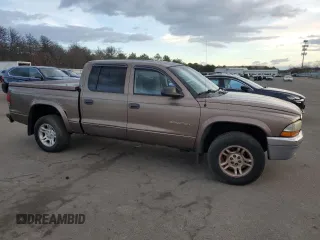 2001 Dodge Dakota z VIN 1B7GG2AX11S108005, wystawiony jako Copart lot #87124934 z przebiegiem 248 482 mil mil oraz Czysty tytuł • Clean title. Historia ofert i sprzedaży dostępna na DreamBid. Obrazek 4.