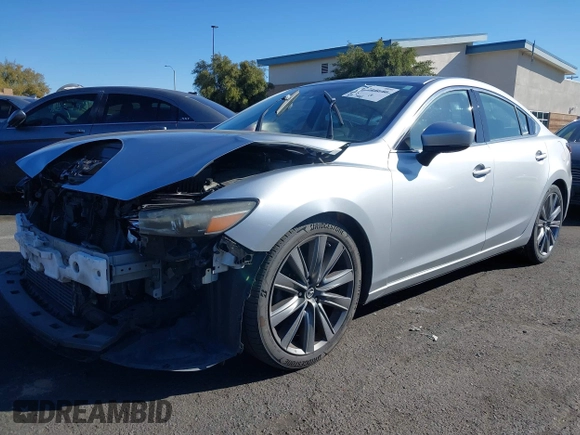 2018 Mazda 6 Grand Touring with VIN JM1GL1TY0J1306768, listed as a IAAI auction lot 41744640 with 81,798 mi miles and . Bid and sale history available at DreamBid. Image 20.