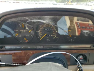 1991 Mercedes-Benz 560 with VIN WDBCA39E9MA599487, listed as a Copart auction lot 51921915 with 59,132 mi miles and Salvage Title. Bid and sale history available at DreamBid. Image 9.