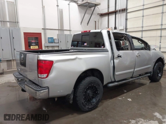 2004 Nissan Titan LE with VIN 1N6AA07B44N512889, listed as a IAAI auction lot 41569019 with 154,655 mi miles. Bid and sale history available at carsss.com. Image 4.