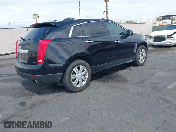 2014 Cadillac SRX Luxury Collection z VIN 3GYFNEE30ES650372, wystawiony jako IAAI lot #42195783 z przebiegiem 169 113 mil mil oraz . Historia ofert i sprzedaży dostępna na DreamBid. Obrazek 4.