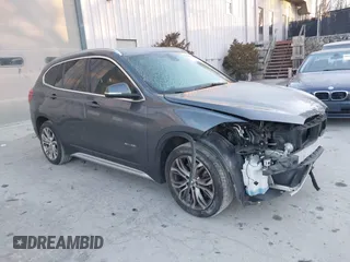 2017 BMW X1 xDrive28i with VIN WBXHT3C33H5F87591, listed as a IAAI auction lot 41256899 with 69,362 mi miles. Bid and sale history available at carsss.com. Image 1.