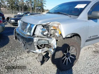 2011 Nissan Titan SL with VIN 1N6AA0EC5BN303931, listed as a IAAI auction lot 41687499 with 243,993 mi miles. Bid and sale history available at carsss.com. Image 6.