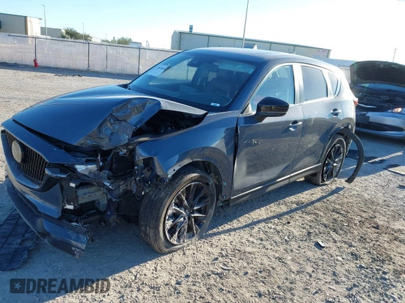 2021 Mazda CX-5 Touring with VIN JM3KFACM1M0371354, listed as a IAAI auction lot 40938490 with 56,172 mi miles. Bid and sale history available at carsss.com. Image 19.