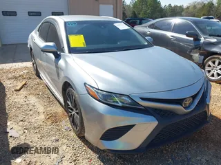 2018 Toyota Camry LE z VIN JTNB11HK5J3027403, wystawiony jako IAAI lot #41857726 z przebiegiem 157 479 mil mil oraz . Historia ofert i sprzedaży dostępna na DreamBid. Obrazek 1.