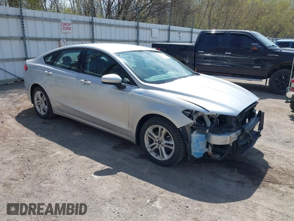 2018 Ford Fusion SE z VIN 3FA6P0H77JR226390, wystawiony jako IAAI lot #42120981 z przebiegiem 114 057 mil mil oraz . Historia ofert i sprzedaży dostępna na DreamBid. Obrazek 1.