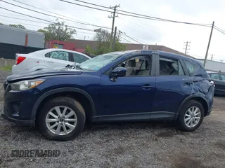 2013 Mazda CX-5 Sport with VIN JM3KE2BE1D0160254, listed as a IAAI auction lot 42256555 with 136,476 mi miles and . Bid and sale history available at DreamBid. Image 14.
