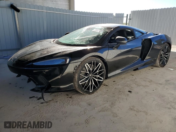2022 McLaren GT z VIN SBM22GCA4NW001602, wystawiony jako Copart lot #83270334 z przebiegiem 33 668 mil mil oraz Tytuł czysty. Historia ofert i sprzedaży dostępna na DreamBid. Obrazek 1.