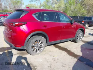 2021 Mazda CX-5 Grand Touring with VIN JM3KFBDM8M1390188, listed as a IAAI auction lot 42000444 with 84,908 mi miles. Bid and sale history available at carsss.com. Image 4.