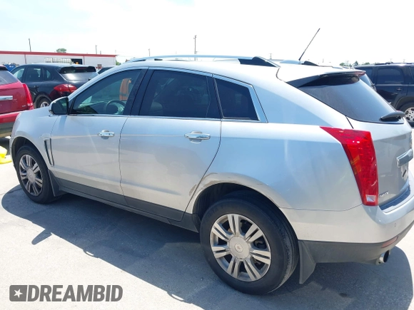 2015 Cadillac SRX Luxury Collection z VIN 3GYFNBE35FS627640, wystawiony jako IAAI lot #42262843 z przebiegiem 211 669 mil mil oraz . Historia ofert i sprzedaży dostępna na DreamBid. Obrazek 14.