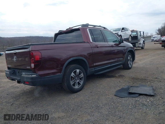 2018 Honda Ridgeline RTL-T with VIN 5FPYK3F69JB010983, listed as a IAAI auction lot 41781716 with 45,494 mi miles and . Bid and sale history available at DreamBid. Image 4.