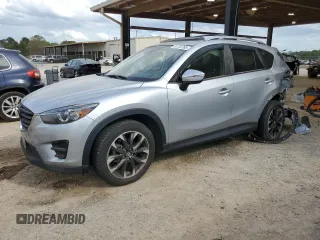 2016 Mazda CX-5 Grand Touring z VIN JM3KE2DY2G0731942, wystawiony jako Copart lot #51723765 z przebiegiem 52 681 mil mil oraz Szkoda całkowita • Salvage title. Historia ofert i sprzedaży dostępna na DreamBid. Obrazek 1.