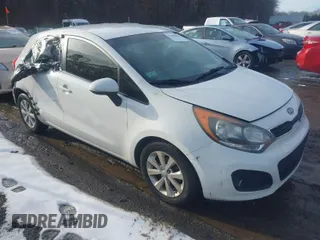 2013 Kia Rio SX with VIN KNADN5A37D6101223, listed as a IAAI auction lot 41480656 with 119,135 mi miles. Bid and sale history available at carsss.com. Image 1.