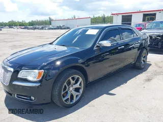 2014 Chrysler 300 C with VIN 2C3CCAKT9EH171614, listed as a IAAI auction lot 39747704 with 129,156 mi miles and . Bid and sale history available at carsss.com. Image 2.