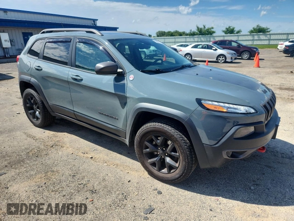 2015 Jeep Cherokee Trailhawk with VIN 1C4PJMBS4FW687328, listed as a Copart auction lot 58927765 with 119,483 mi miles and Non repairable. Bid and sale history available at DreamBid. Image 4.