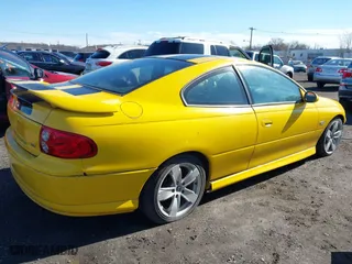 2004 Pontiac GTO with VIN 6G2VX12G54L245972, listed as a IAAI auction lot 41819699 with 77,198 mi miles. Bid and sale history available at carsss.com. Image 4.