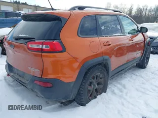 2015 Jeep Cherokee Trailhawk with VIN 1C4PJMBS9FW655233, listed as a IAAI auction lot 41430715 with 138,181 mi miles and . Bid and sale history available at carsss.com. Image 4.