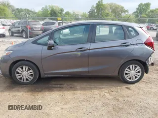 2015 Honda Fit LX with VIN 3HGGK5H58FM722880, listed as a IAAI auction lot 42276261 with 104,886 mi miles and . Bid and sale history available at DreamBid. Image 14.