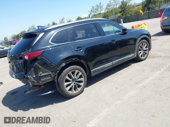 2016 Mazda CX-9 Grand Touring with VIN JM3TCBDY4G0113693, listed as a IAAI auction lot 41965857 with 152,403 mi miles and . Bid and sale history available at DreamBid. Image 4.