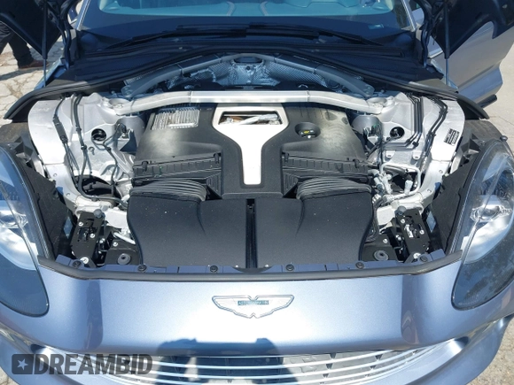 2021 Aston Martin DBX z VIN SCFVUJAW8MTV02568, wystawiony jako IAAI lot #42183964 z przebiegiem 53 608 mil mil oraz . Historia ofert i sprzedaży dostępna na DreamBid. Obrazek 10.