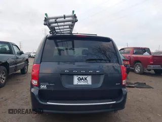 2014 Dodge Grand Caravan SXT with VIN 2C4RDGCG8ER257837, listed as a IAAI auction lot 41211629 with 139,231 mi miles and . Bid and sale history available at DreamBid. Image 17.