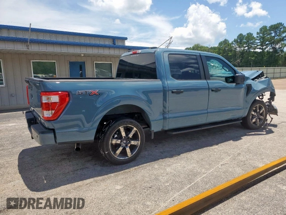 2023 Ford F-150 XL with VIN 1FTEW1CP7PKD02399, listed as a Copart auction lot 60738155 with 23,059 mi miles and Salvage title. Bid and sale history available at DreamBid. Image 3.
