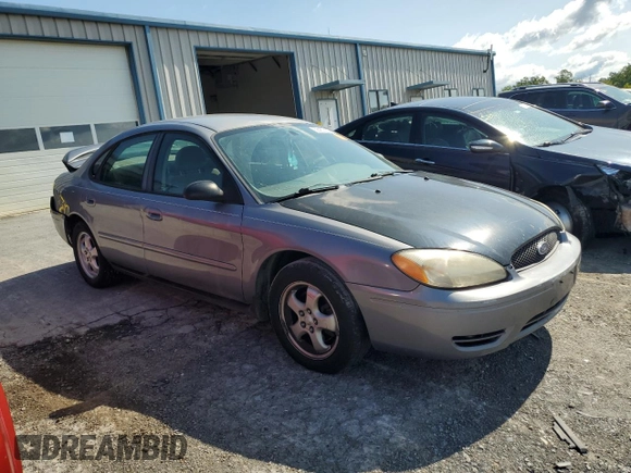 2006 Ford Taurus SE with VIN 1FAFP53U36A262525, listed as a Copart auction lot 86797374 with 179,508 mi miles and Salvage title. Bid and sale history available at DreamBid. Image 4.