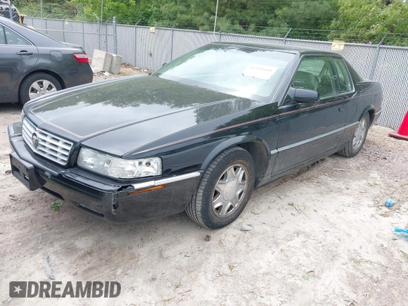 2002 Cadillac Eldorado ESC z VIN 1G6EL12Y82B105241, wystawiony jako IAAI lot #42241609 z przebiegiem 90 442 mil mil oraz . Historia ofert i sprzedaży dostępna na DreamBid. Obrazek 2.